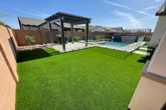 A backyard with a gazebo and a pool